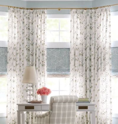 Living room with white plantation shutters in Tulsa luxury home